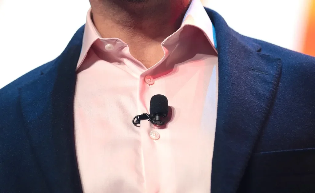 Wireless lavalier microphone clipped to a speaker's shirt